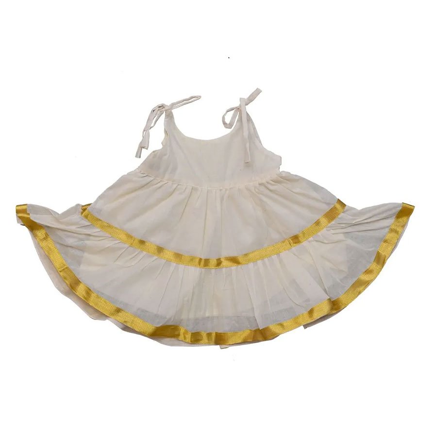 A full circle gown featuring three ruffled tiers in an authentic Kerala kasavu fabric. Perfect for your little girl to celebrate her festivities with fun.