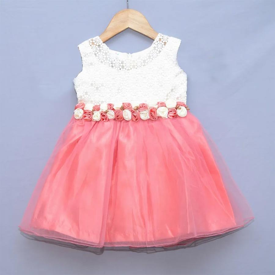 A pastel toned tulle gown with beautiful satin flower detailing for your little princess.